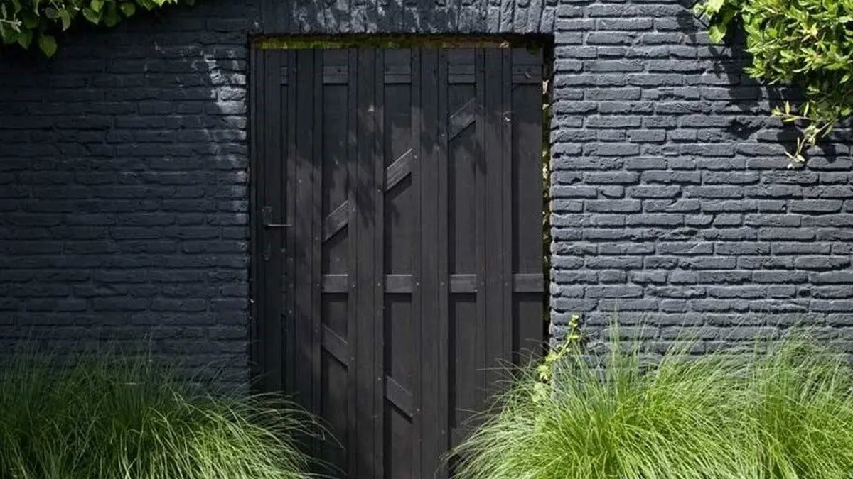 Black painted brick wall